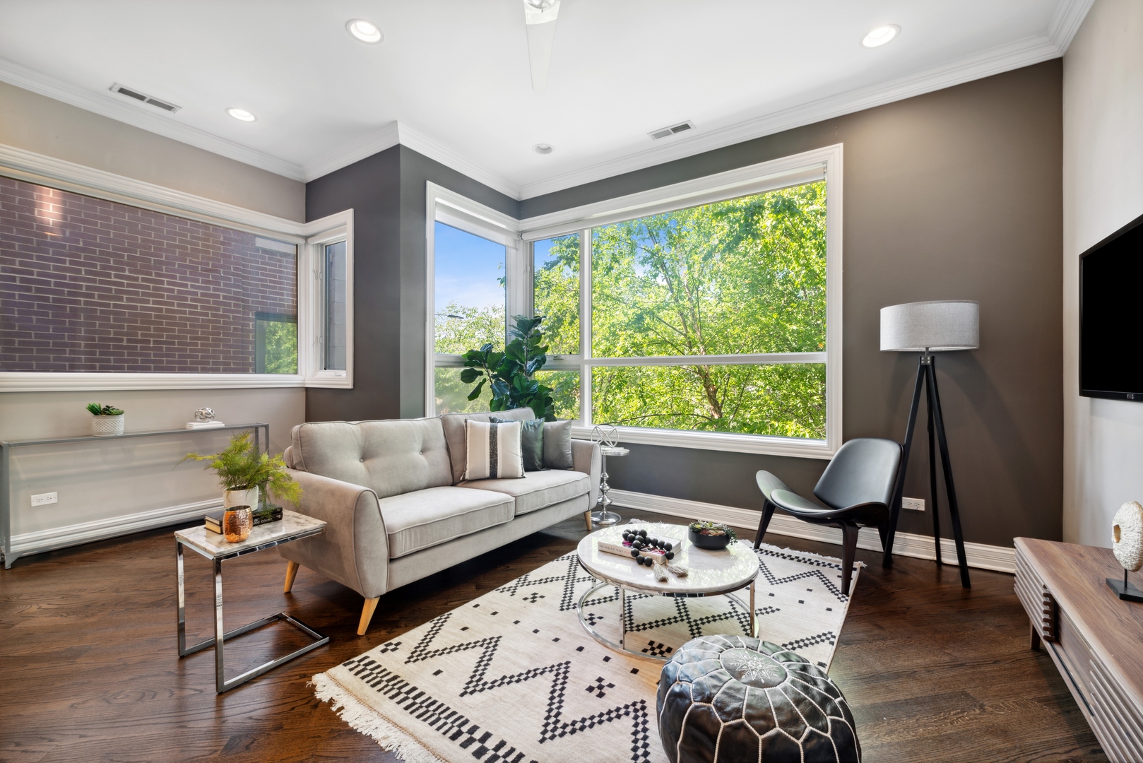 1131 West Addison Street, Unit 2 Chicago, IL 60613 - Photo 5 of 21 a living room with furniture and a large window
