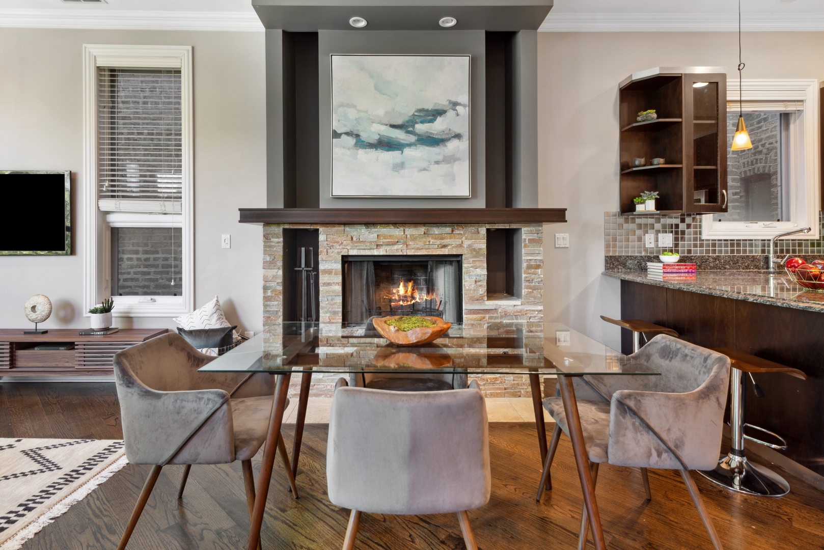 1131 West Addison Street, Unit 2 Chicago, IL 60613 - Photo 8 of 21 a living room with furniture a fireplace and a flat screen tv