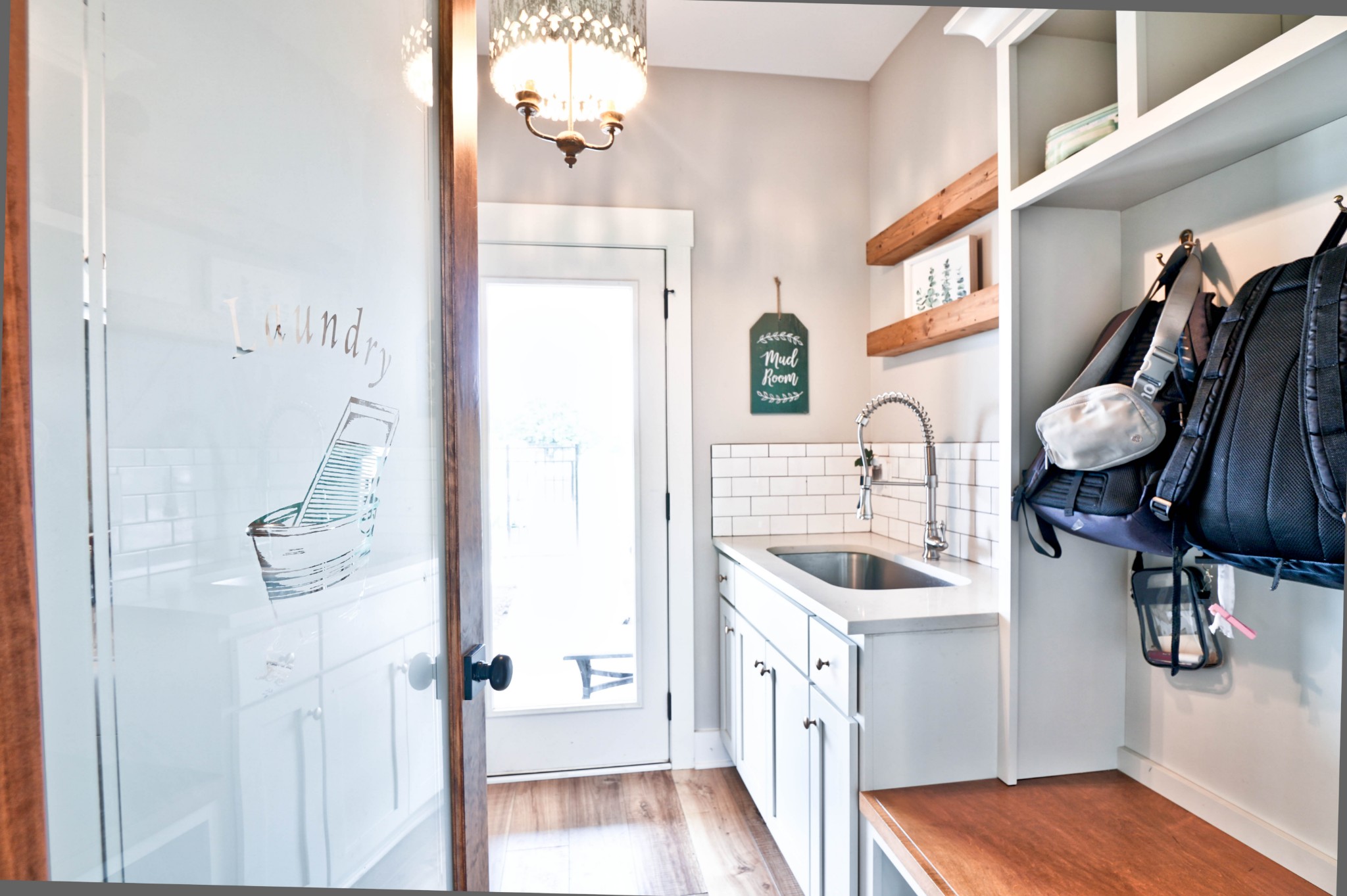 6992 Wayside Road Christiana, TN 37037 - Photo 25 of 44 Laundry has built-in storage, custom floating shelves & hall tree with a tile surround sink.