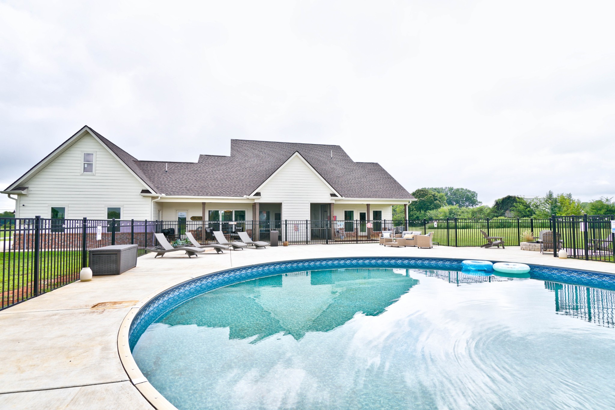 6992 Wayside Road Christiana, TN 37037 - Photo 40 of 44 150+ ft of concrete space with complete aluminum fencing surrounding the pool deck!