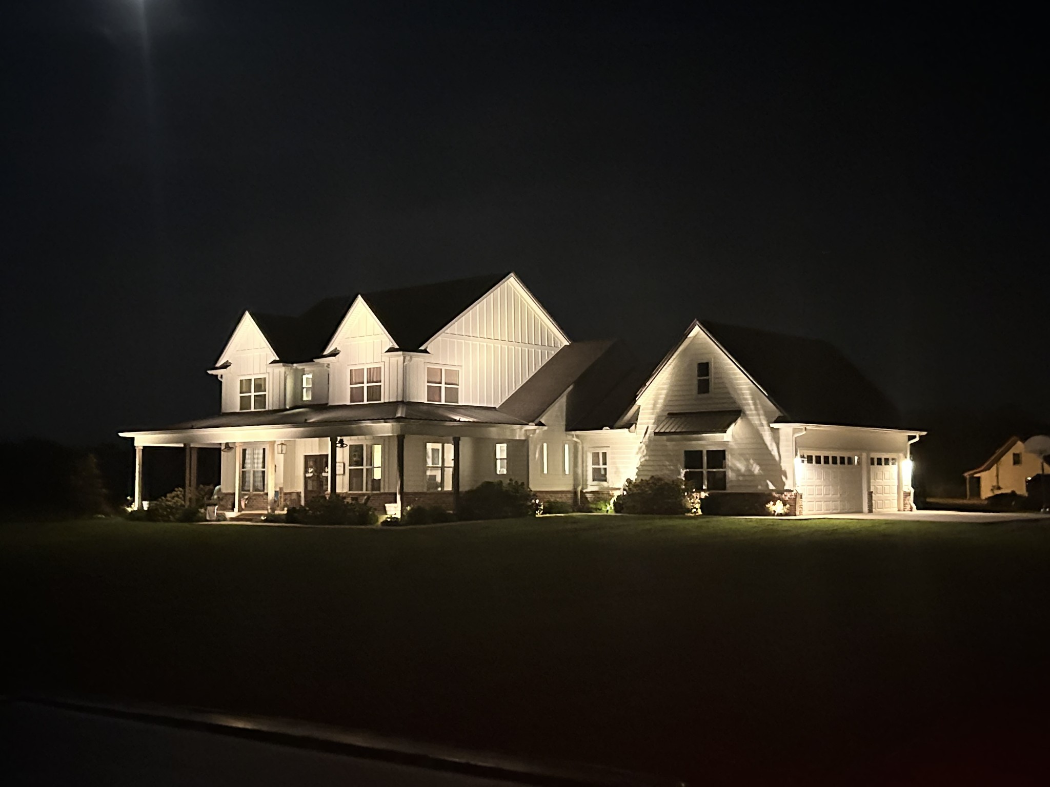 6992 Wayside Road Christiana, TN 37037 - Photo 5 of 44 Professional auto outdoor lighting illuminates the home provides a welcoming ambiance for arriving guests...not to mention showcasing the beauty of this modern-day farmhouse!