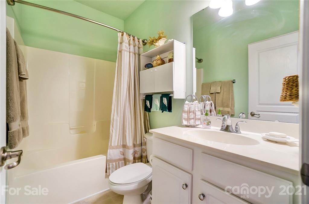 2135 Ashley River Road Waxhaw, NC 28173 - Photo 15 of 17 a bathroom with a sink a toilet and shower