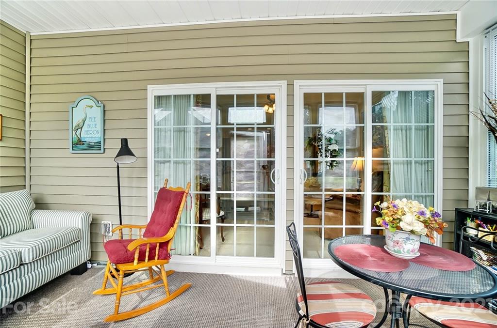 2135 Ashley River Road Waxhaw, NC 28173 - Photo 10 of 17 a patio with glass top table and chairs