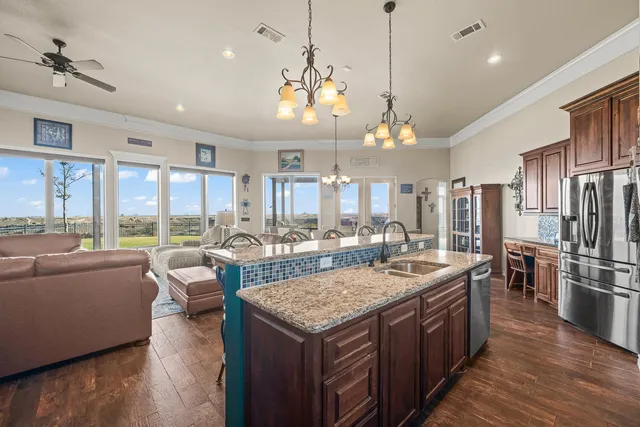 a kitchen with a sink stove and cabinets