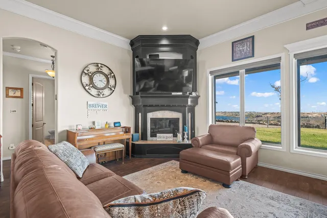a kitchen with stainless steel appliances granite countertop a sink refrigerator and cabinets