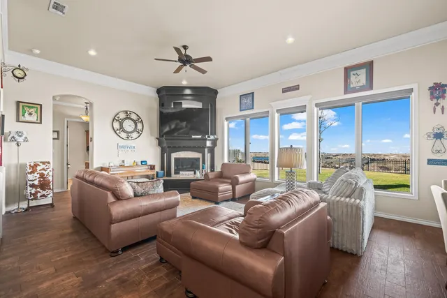 a spacious bedroom with a bed and a chandelier
