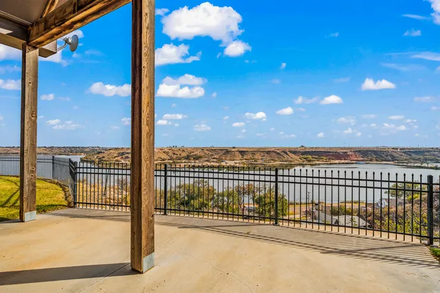 a balcony with furniture and city view