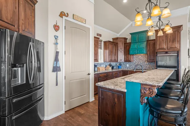 a bathroom with a granite countertop tub sink and mirror
