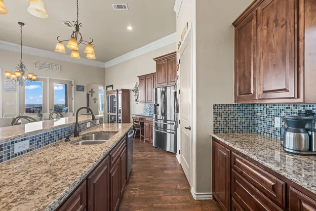 a large bathroom with a sink a large mirror and a shower