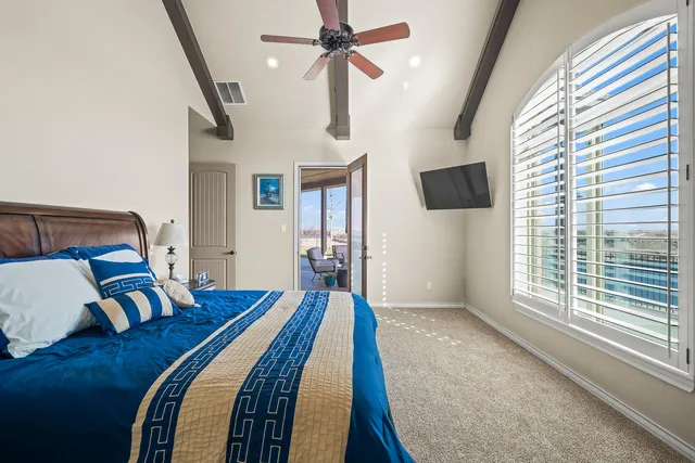 a bedroom with a bed furniture and a window