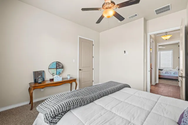 a building outdoor space with patio furniture and potted plants