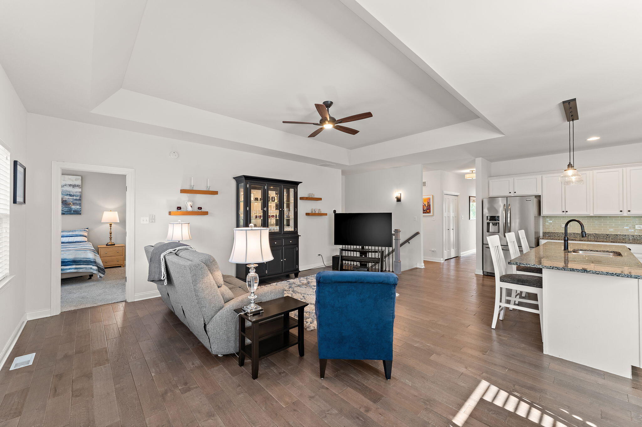 10138 Privet Drive Crown Point, IN 46307 - Photo 11 of 39 a living room with furniture and a flat screen tv