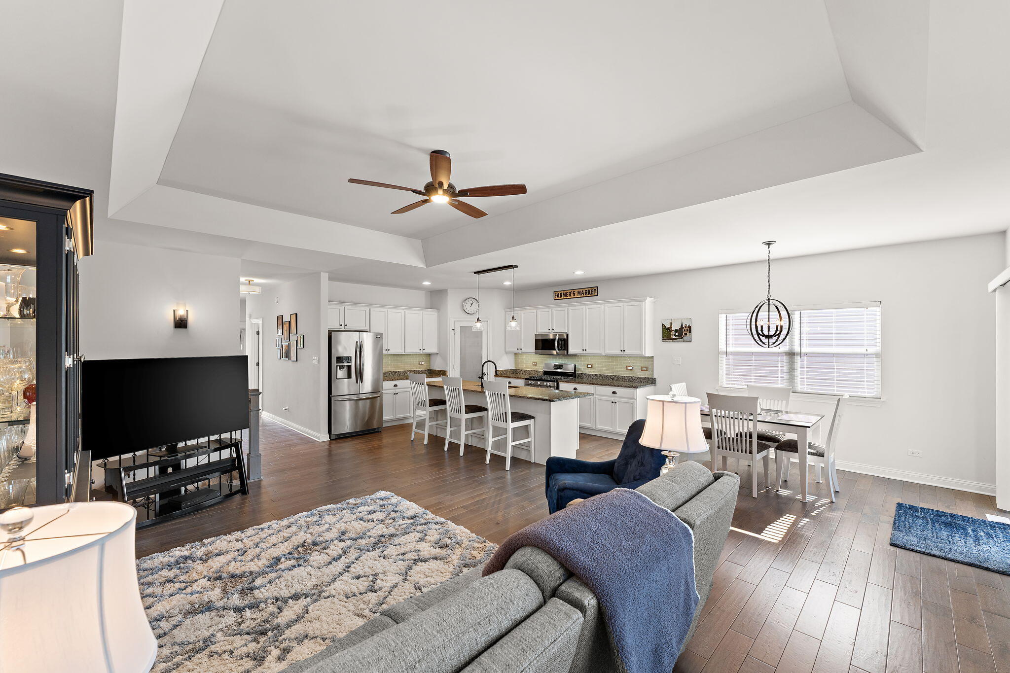 10138 Privet Drive Crown Point, IN 46307 - Photo 12 of 39 a living room with lots of furniture and a flat screen tv