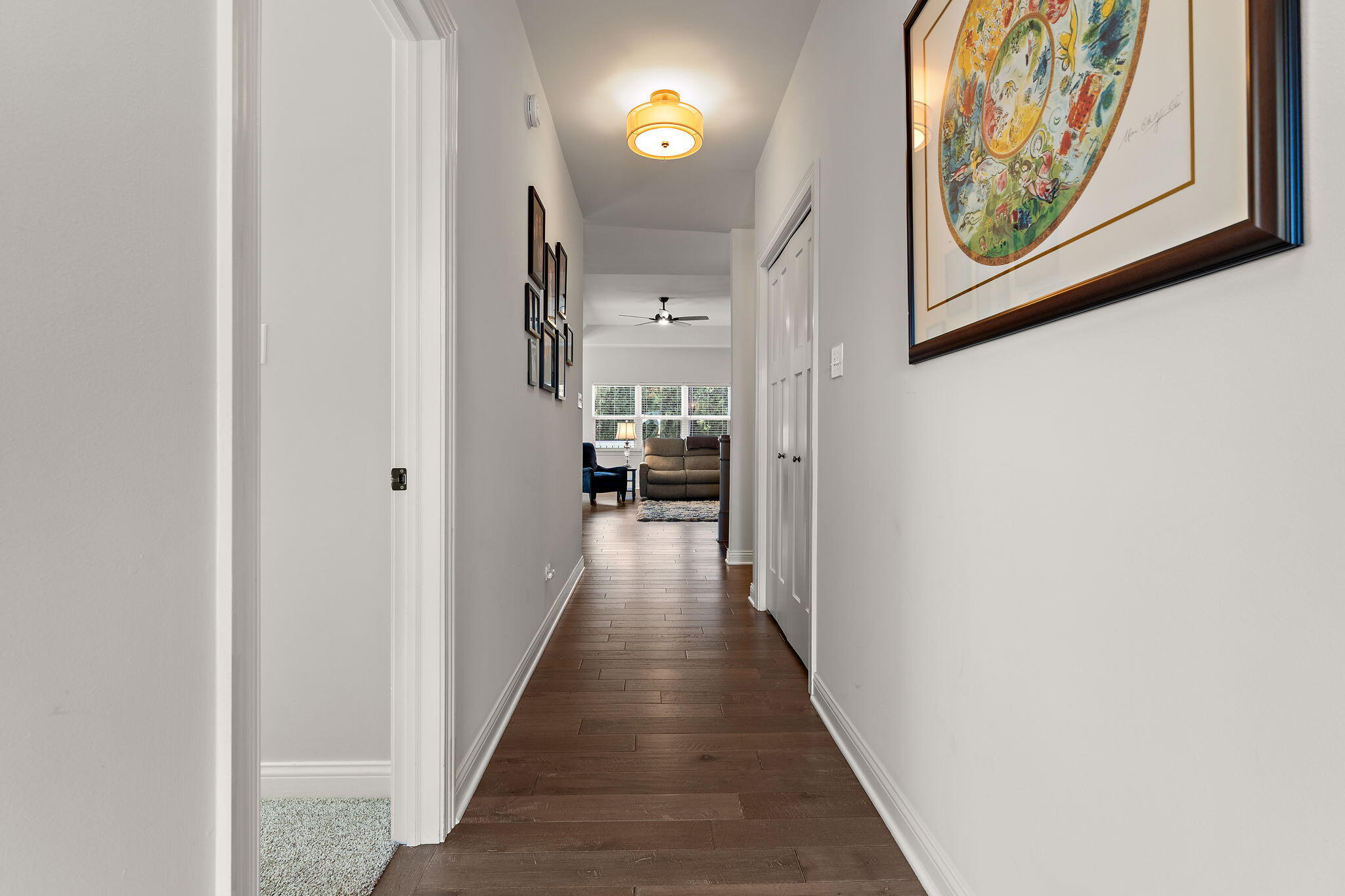 10138 Privet Drive Crown Point, IN 46307 - Photo 13 of 39 a view of a hallway with wooden floor