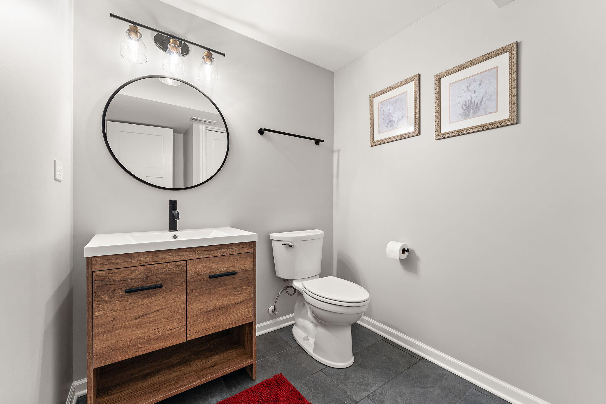 10138 Privet Drive Crown Point, IN 46307 - Photo 25 of 39 a bathroom with a toilet sink and mirror