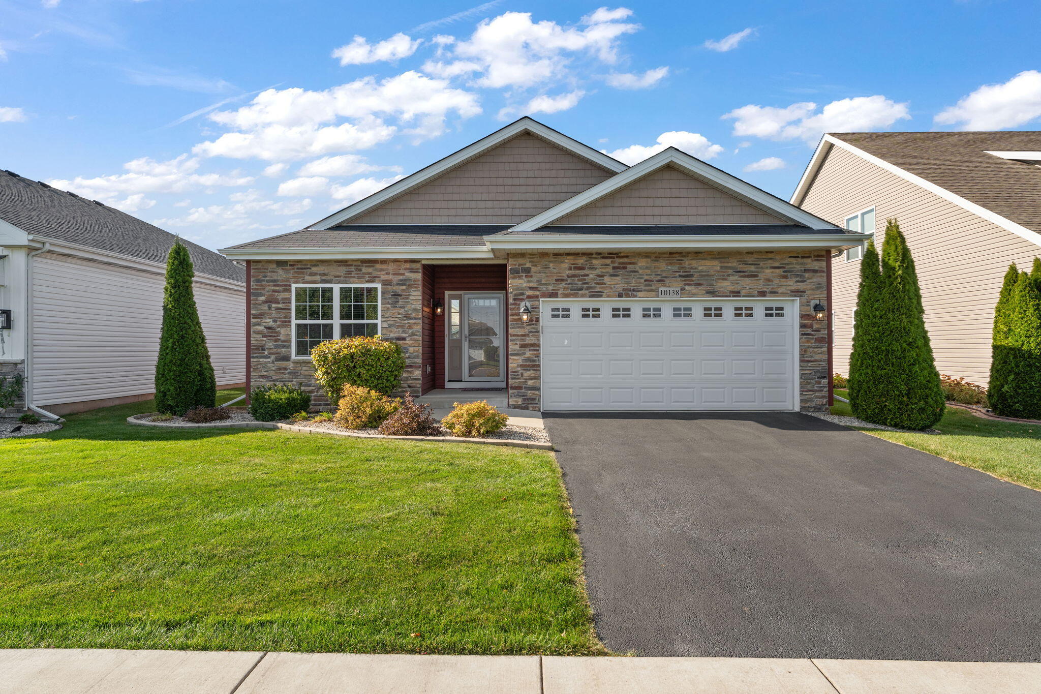 10138 Privet Drive Crown Point, IN 46307 - Photo 36 of 39 a front view of a house with garden