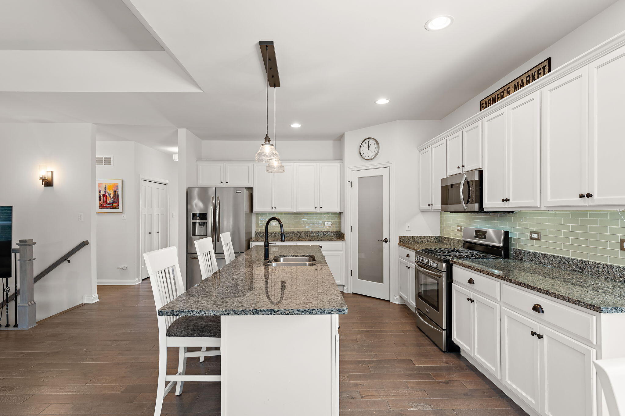 10138 Privet Drive Crown Point, IN 46307 - Photo 4 of 39 a kitchen with stainless steel appliances granite countertop a sink stove and refrigerator