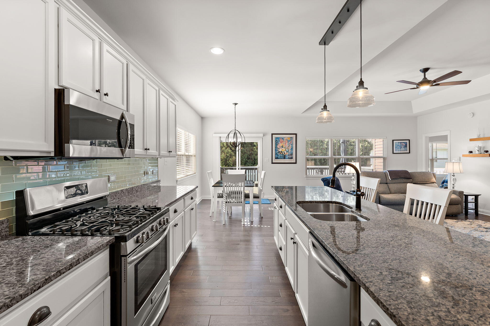 10138 Privet Drive Crown Point, IN 46307 - Photo 7 of 39 a kitchen with stainless steel appliances granite countertop a sink stove and refrigerator