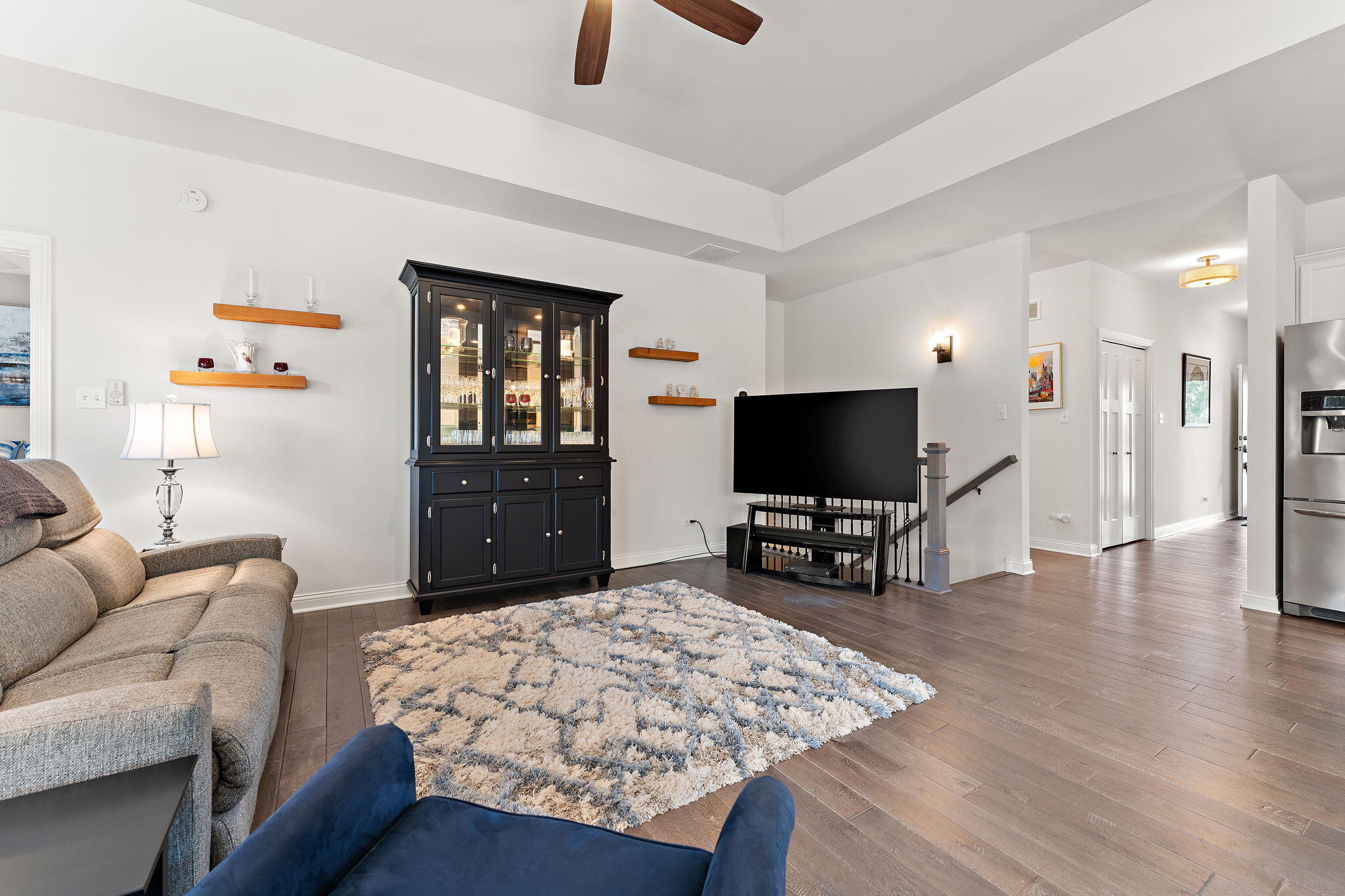 10138 Privet Drive Crown Point, IN 46307 - Photo 10 of 39 a living room with furniture and a flat screen tv