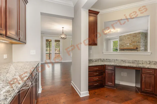 a view of a kitchen cabinets and a wooden floor