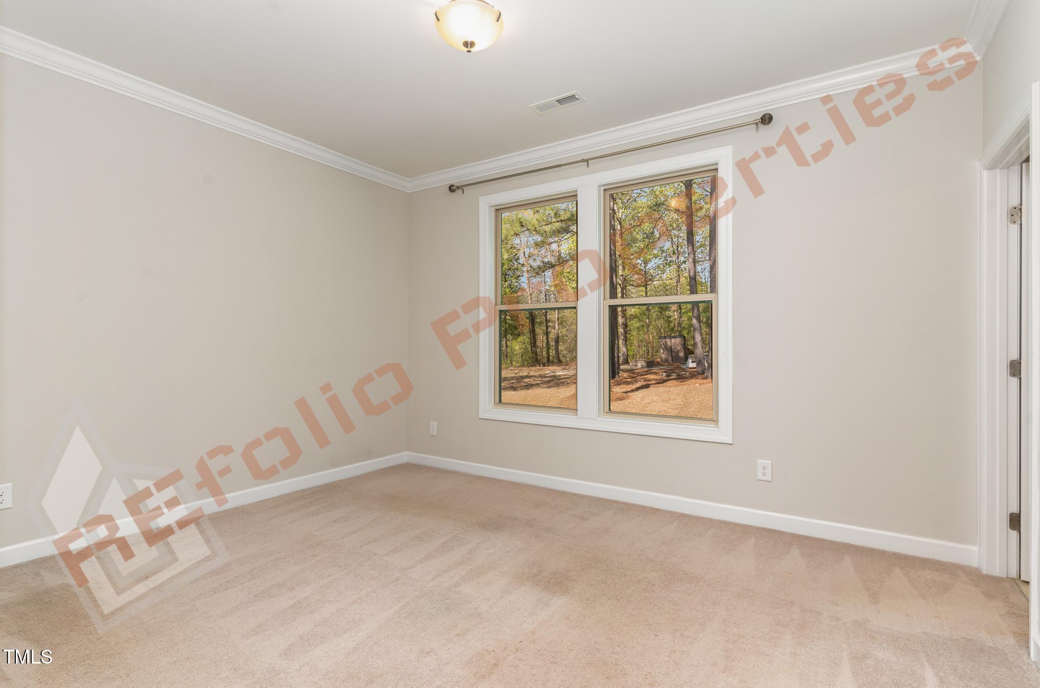 1001 Covered Bridge Trail Chapel Hill, NC 27517 - Photo 12 of 41 a view of an empty room with a window