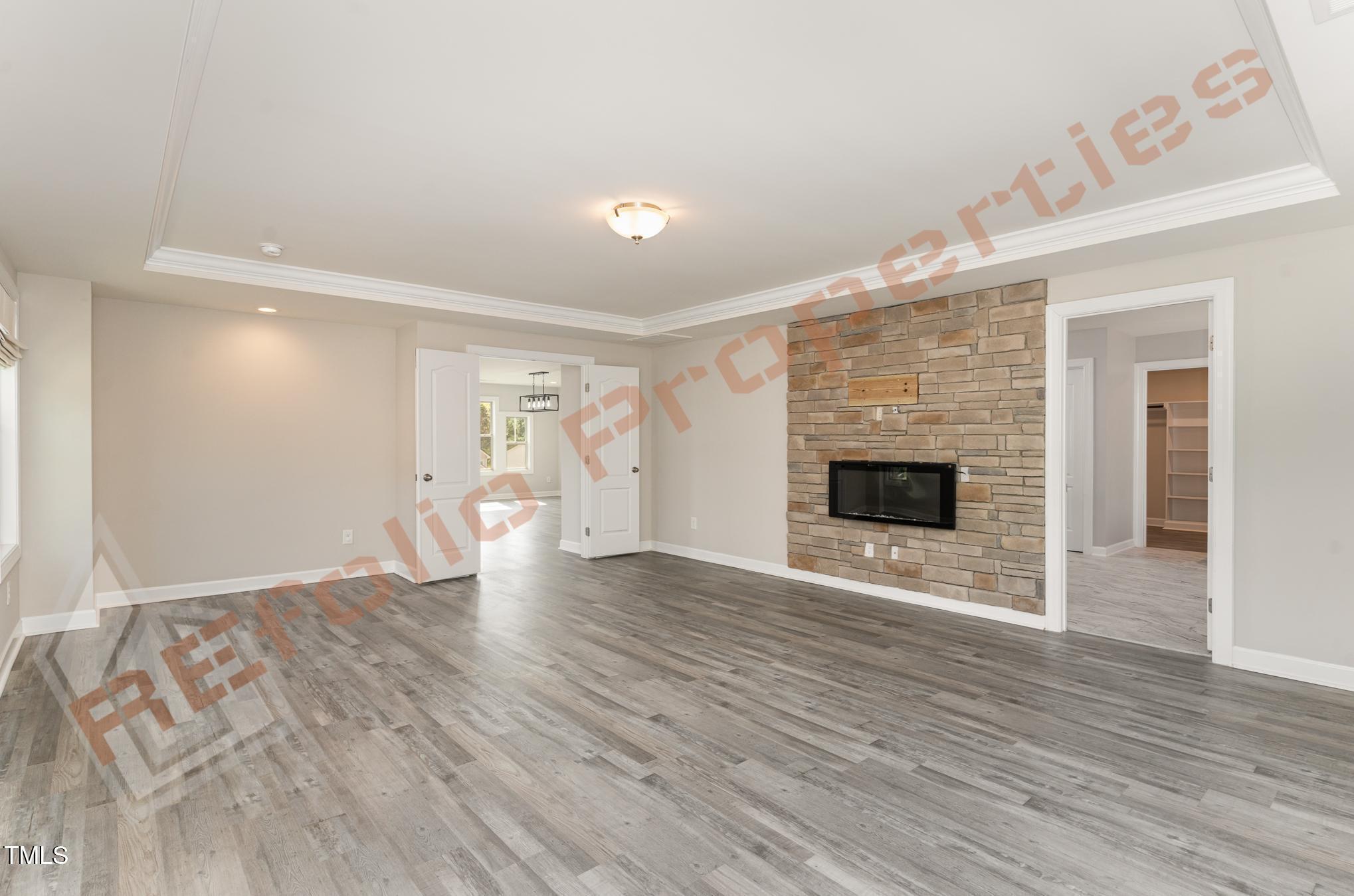 1001 Covered Bridge Trail Chapel Hill, NC 27517 - Photo 16 of 41 a view of an empty room with wooden floor fireplace and a window