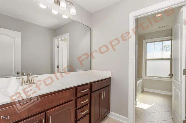 a bathroom with a sink a vanity and a mirror