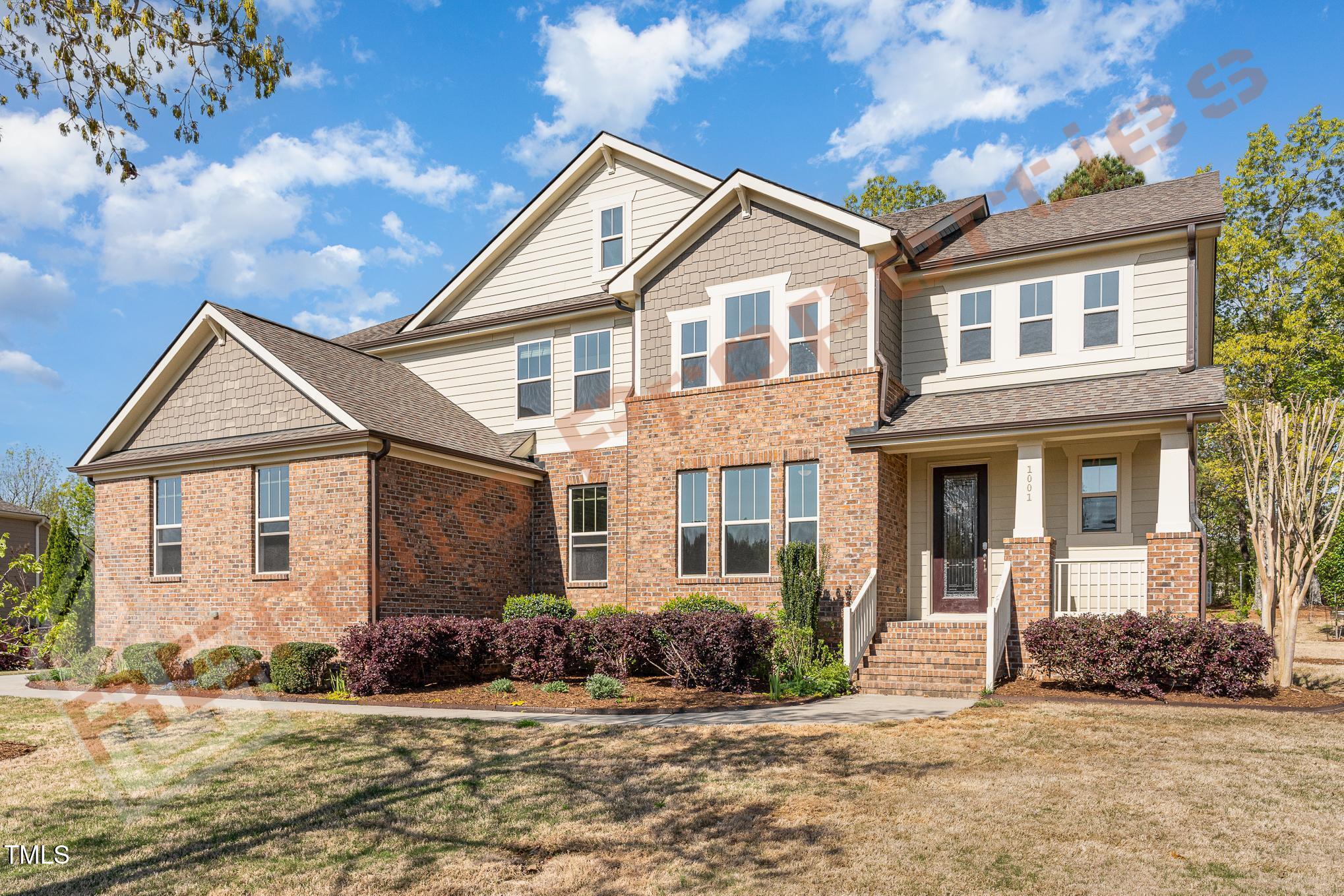 1001 Covered Bridge Trail Chapel Hill, NC 27517 - Photo 2 of 41 a front view of a house with a yard