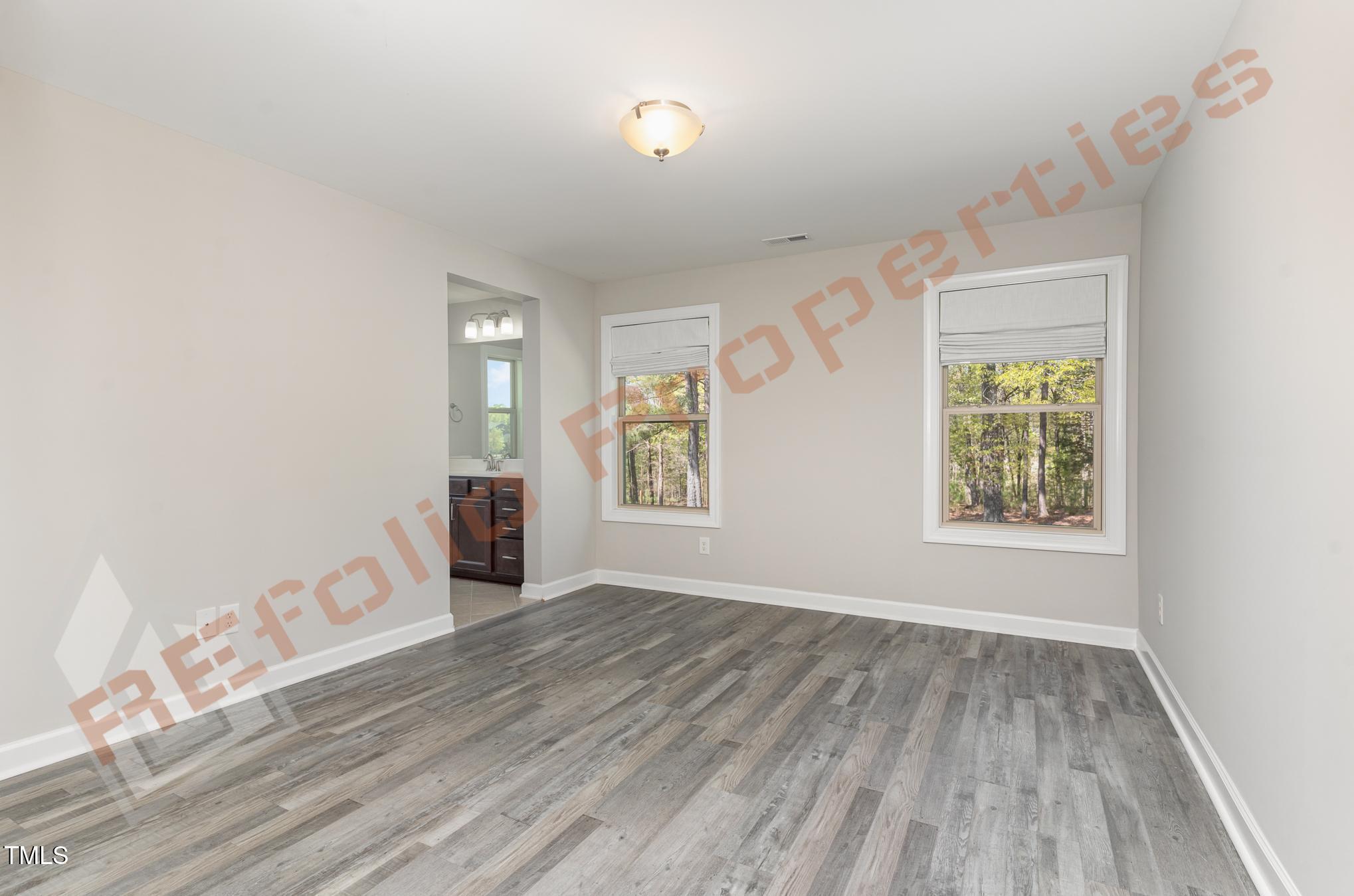 1001 Covered Bridge Trail Chapel Hill, NC 27517 - Photo 22 of 41 wooden floor in an empty room with a window