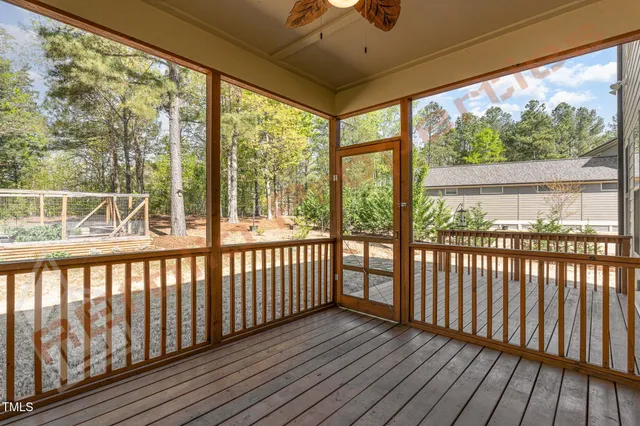a view of porch with wooden floor