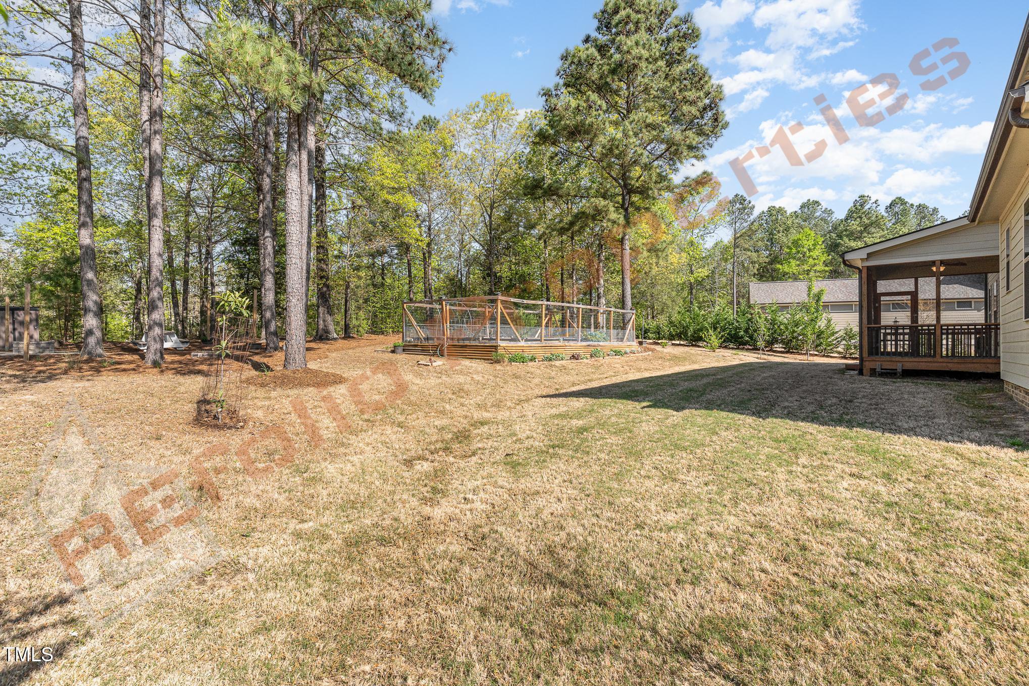 1001 Covered Bridge Trail Chapel Hill, NC 27517 - Photo 29 of 41 a backyard of a house with trees and outdoor space
