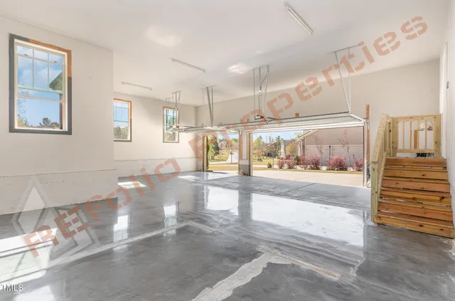 a view of a hallway with the view of a living room