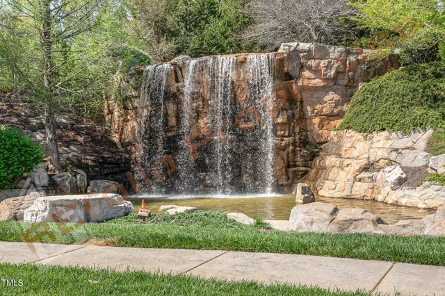 a view of yard with tree in the background
