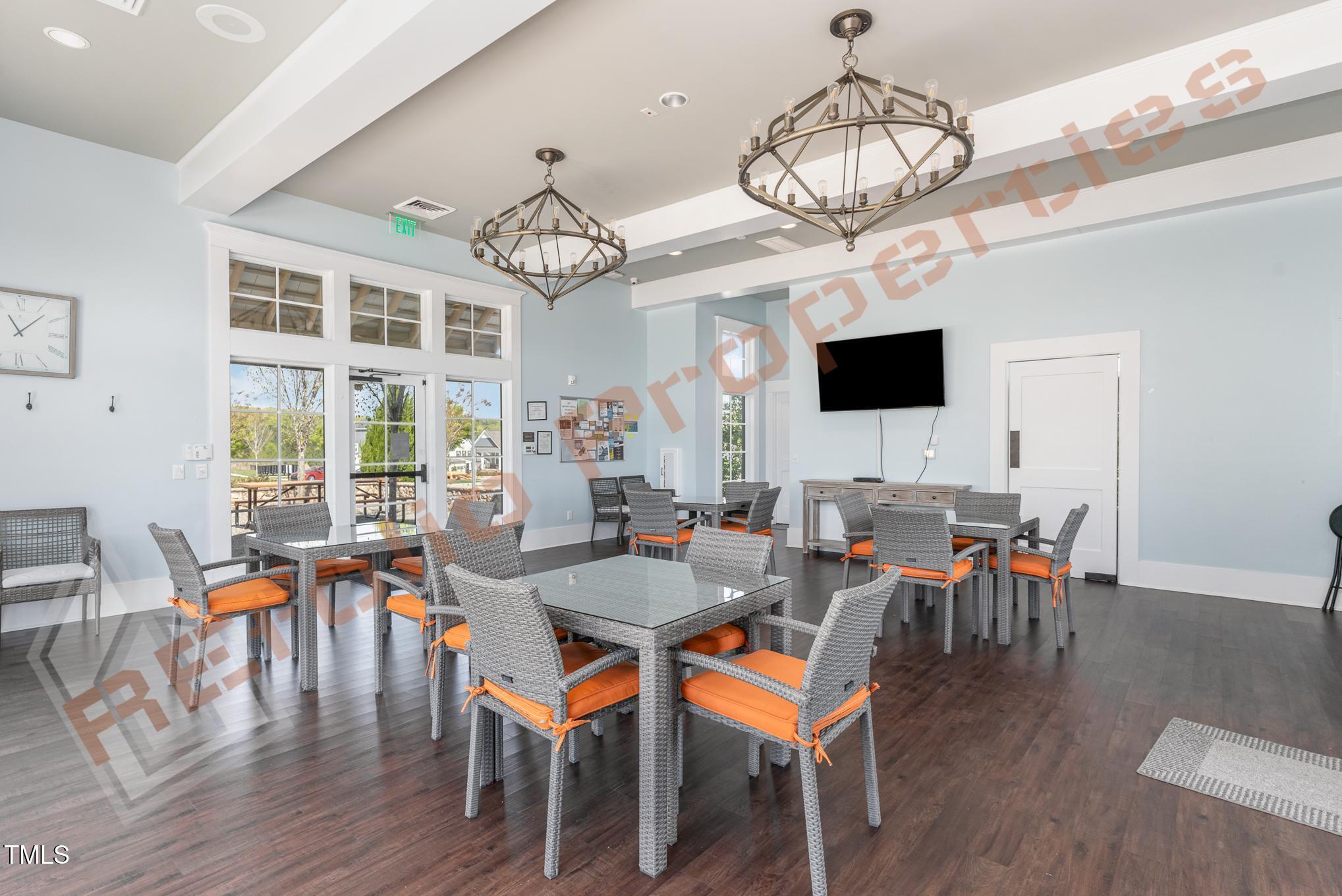 1001 Covered Bridge Trail Chapel Hill, NC 27517 - Photo 37 of 41 a view of a dining room with furniture wooden floor and chandelier