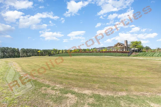 a view of a lake with houses in the back