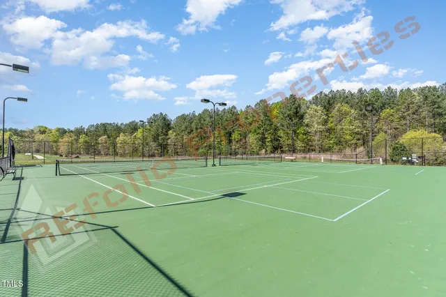 a view of an outdoor space and tennis court