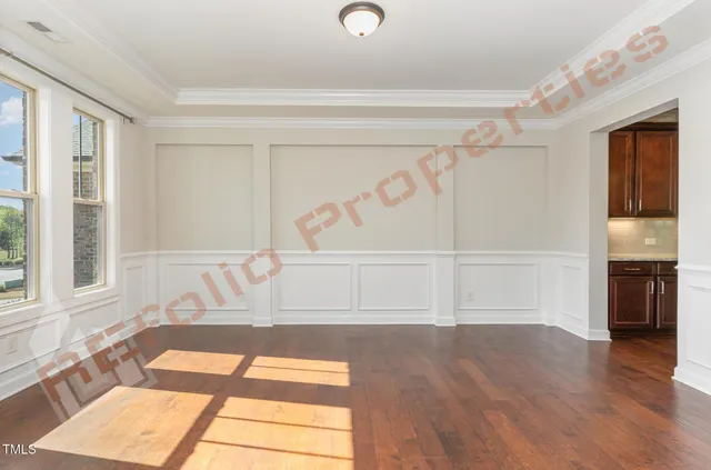 a view of a livingroom with an empty space and a window