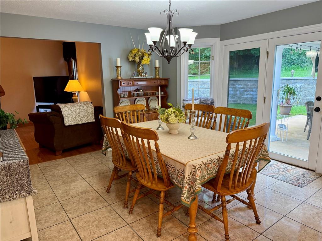 293 Sandy Hill Road Valencia, PA 16059 - Photo 30 of 50 a view of a dining room with furniture a livingroom and chandelier