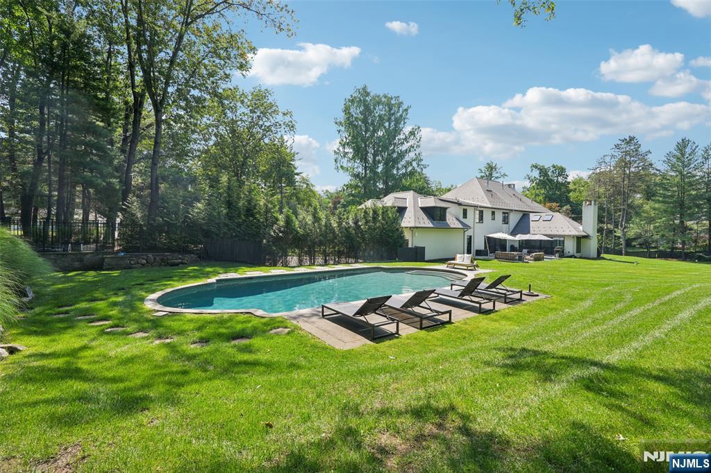 58 Twin Brooks Road Saddle River, NJ 07458 - Photo 36 of 45 a view of a house with a big yard