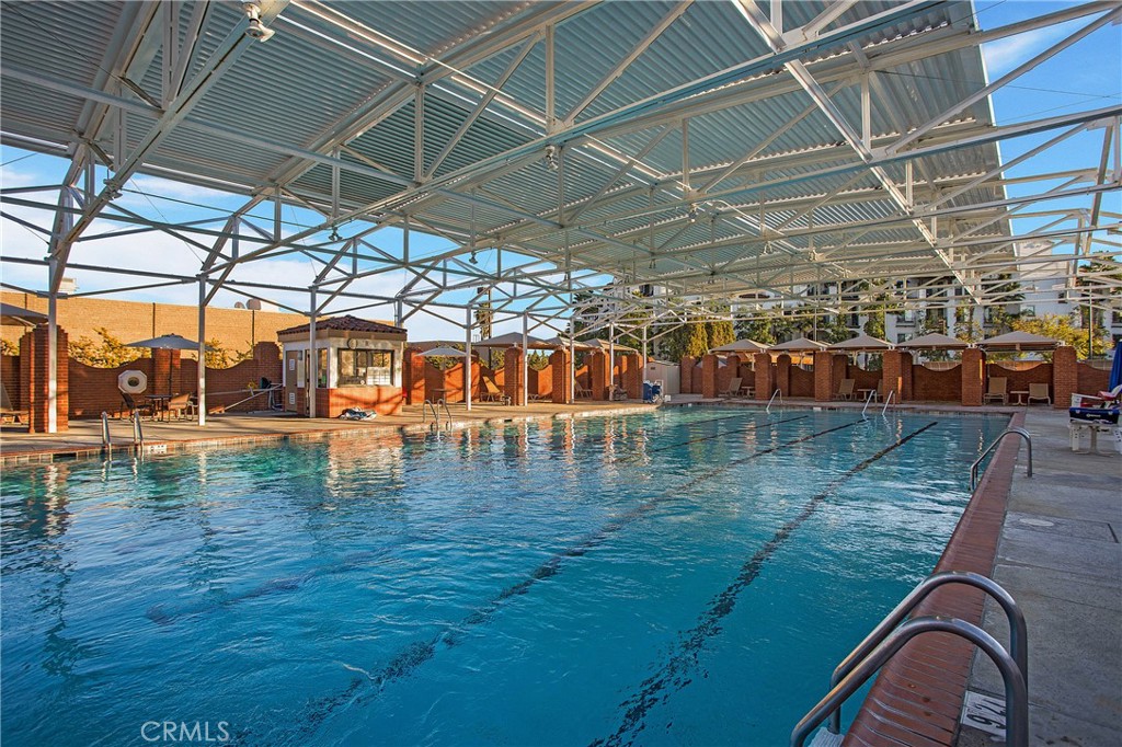 662 Via Los Altos, Unit P Laguna Woods, CA 92637 - Photo 32 of 46 a view of a swimming pool with a patio