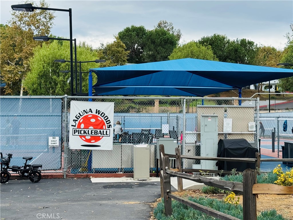 662 Via Los Altos, Unit P Laguna Woods, CA 92637 - Photo 34 of 46 a view of outdoor space with seating area and sign board