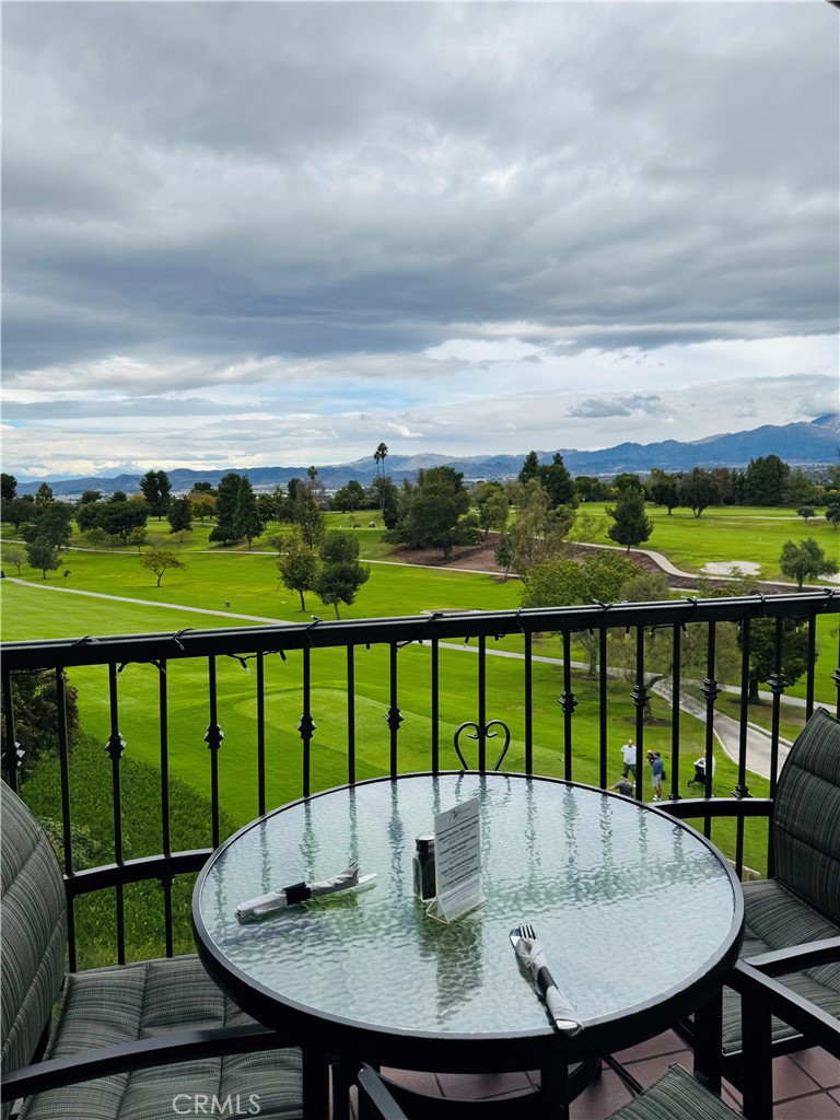 662 Via Los Altos, Unit P Laguna Woods, CA 92637 - Photo 40 of 46 a view of a balcony with a table and chairs