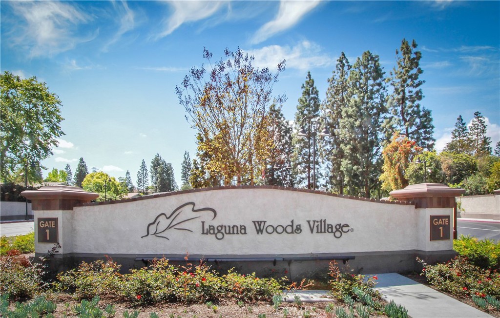 662 Via Los Altos, Unit P Laguna Woods, CA 92637 - Photo 42 of 46 a sign that is sitting in front of flowers