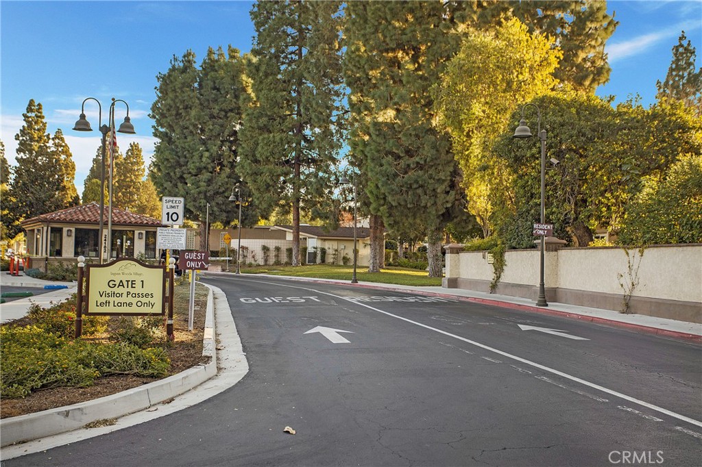 662 Via Los Altos, Unit P Laguna Woods, CA 92637 - Photo 44 of 46 a front view of a building with trees