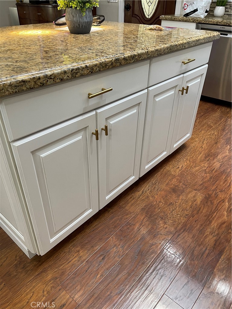 662 Via Los Altos, Unit P Laguna Woods, CA 92637 - Photo 7 of 46 a view of a kitchen counter space and wooden floor