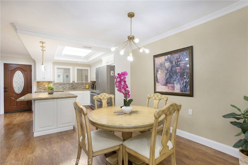 662 Via Los Altos, Unit P Laguna Woods, CA 92637 - Photo 9 of 46 a view of a dining room with furniture and wooden floor
