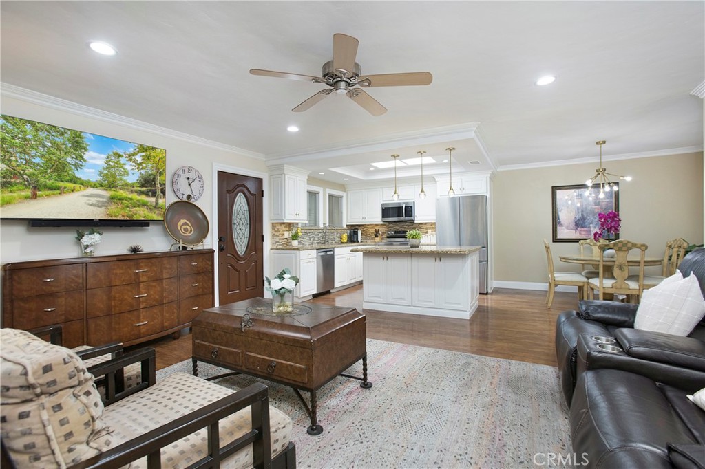 662 Via Los Altos, Unit P Laguna Woods, CA 92637 - Photo 10 of 46 a living room with furniture and a flat screen tv