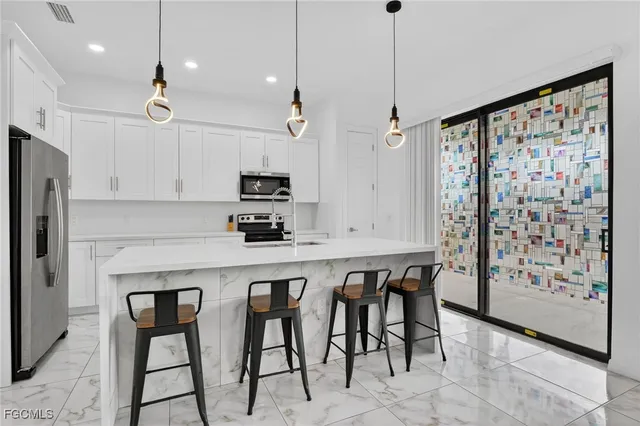 a bedroom with a bed and a bathroom