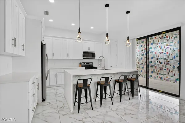 $465,000 | 2513 69th Street West, Lehigh Acres, FL 33971