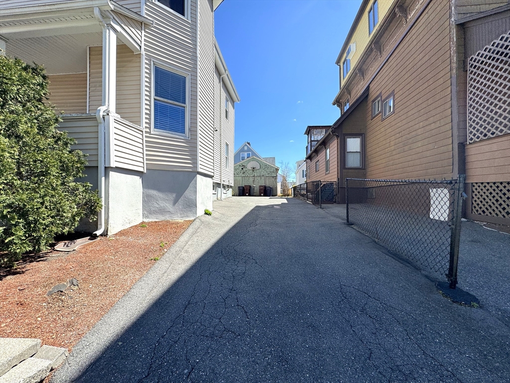 69 Cleveland Avenue, Unit 1 Everett, MA 02149 - Photo 13 of 13 a view of a house with a patio